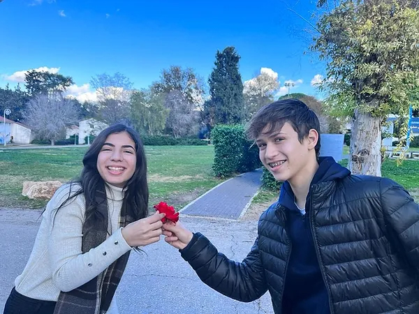 Young couple holding flower